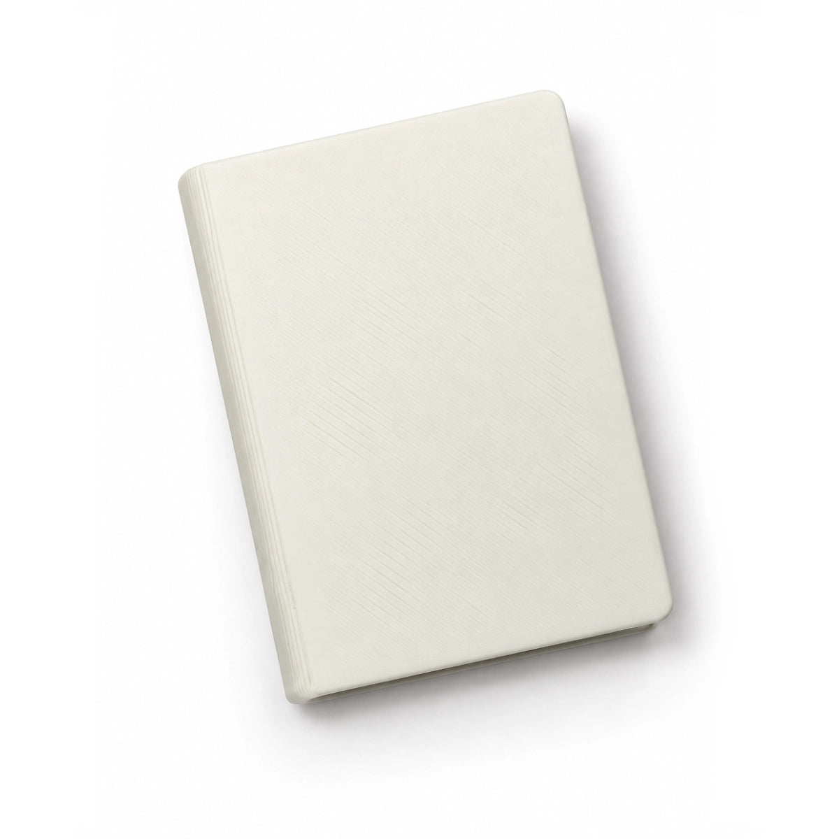 3D printed mini book magnet blank, white, showing the spine and page edges