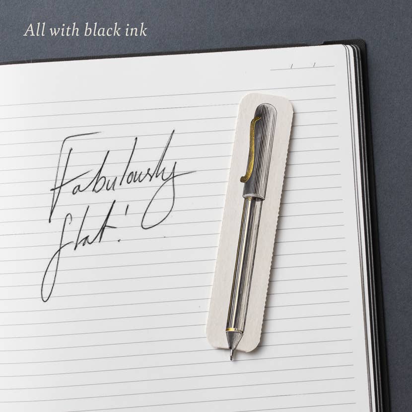 A Fabulously Flat paper pen on a lined notebook page with handwriting in black ink