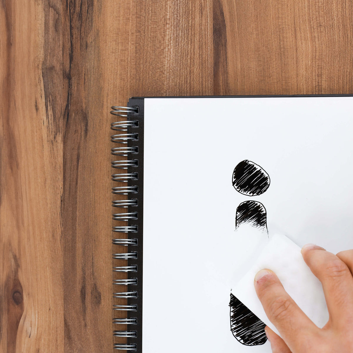 Erasing a page of an Infinitebook with the cleaning sponge
