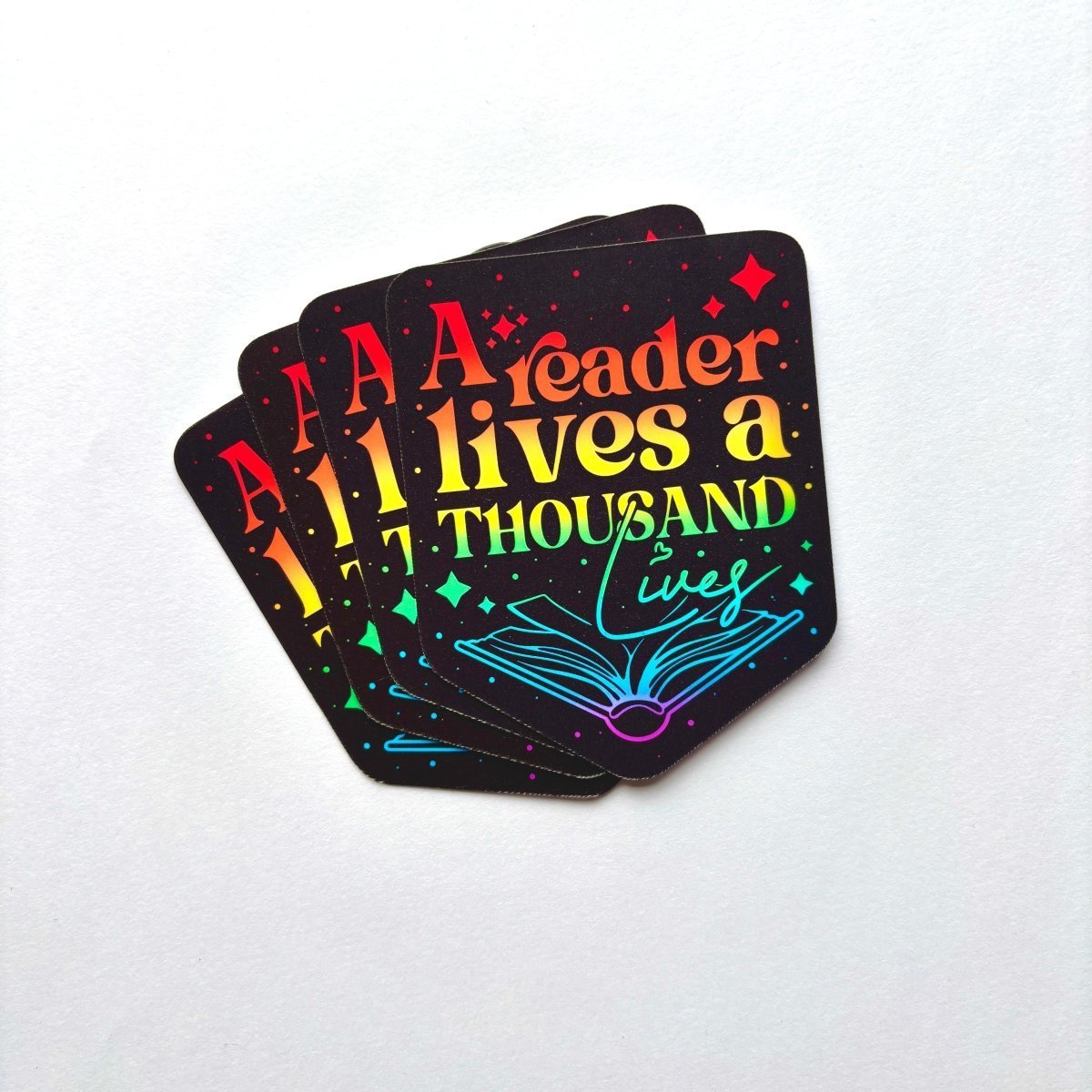 A Reader Lives a Thousand Lives Sticker - Stickiply
