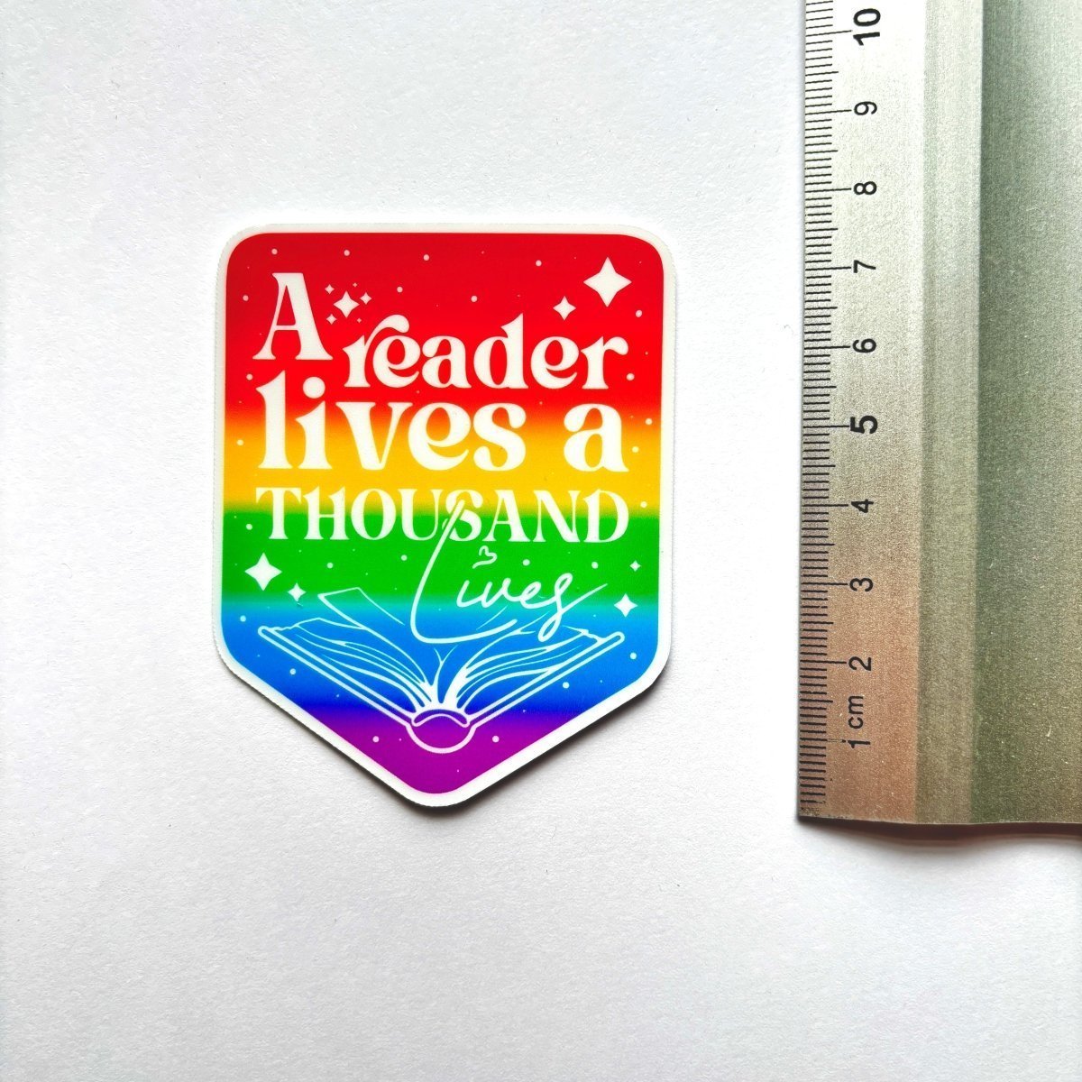 A Reader Lives a Thousand Lives Sticker - Stickiply