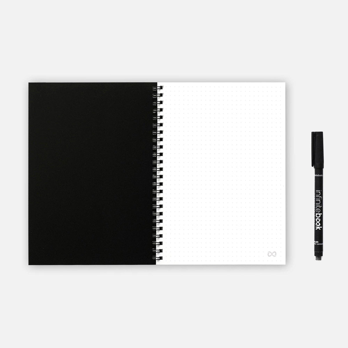 Infinitebook Dotted A5 Black reusable notebook open on a dotted page spread